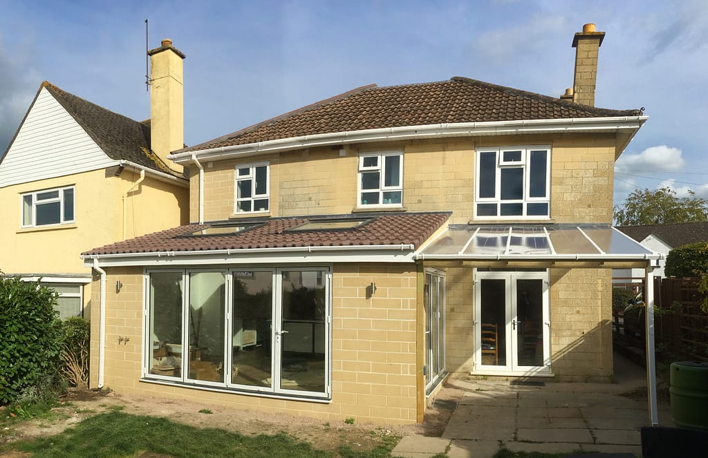 AFTER: Two storey side extension and single storey rear extension with veranda, built in stone to match existing house. Hills close, Keynsham, 2017.