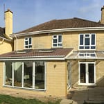 AFTER: Two storey side extension and single storey rear extension with veranda, built in stone to match existing house. Hills close, Keynsham, 2017.